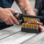 TacticPower Universal Rifle Magazine Loader – product lifestyle shot showing range-ready setup
